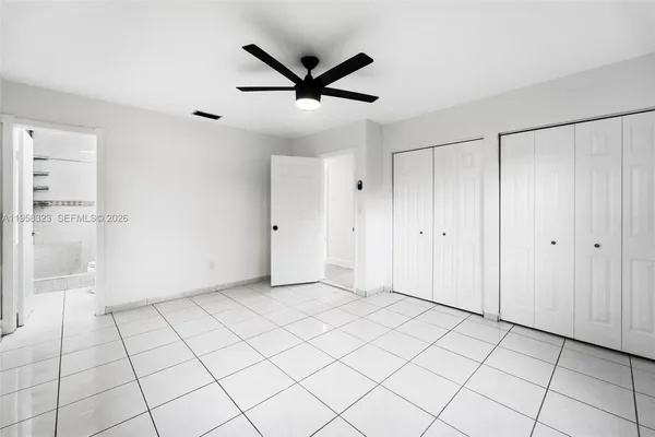 a bathroom with a toilet sink and a mirror