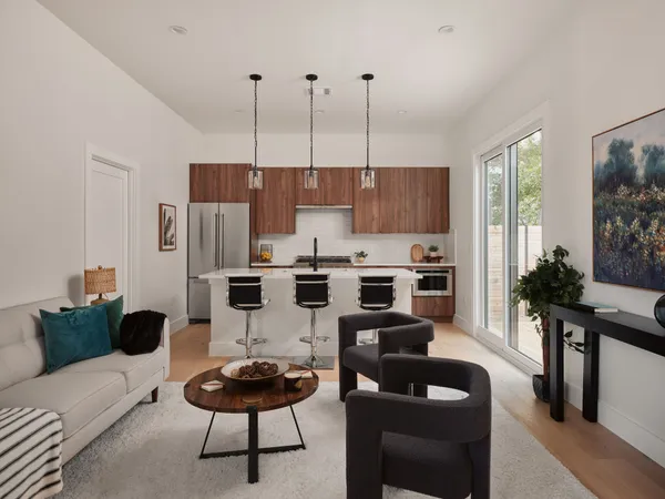a living room with furniture and a chandelier