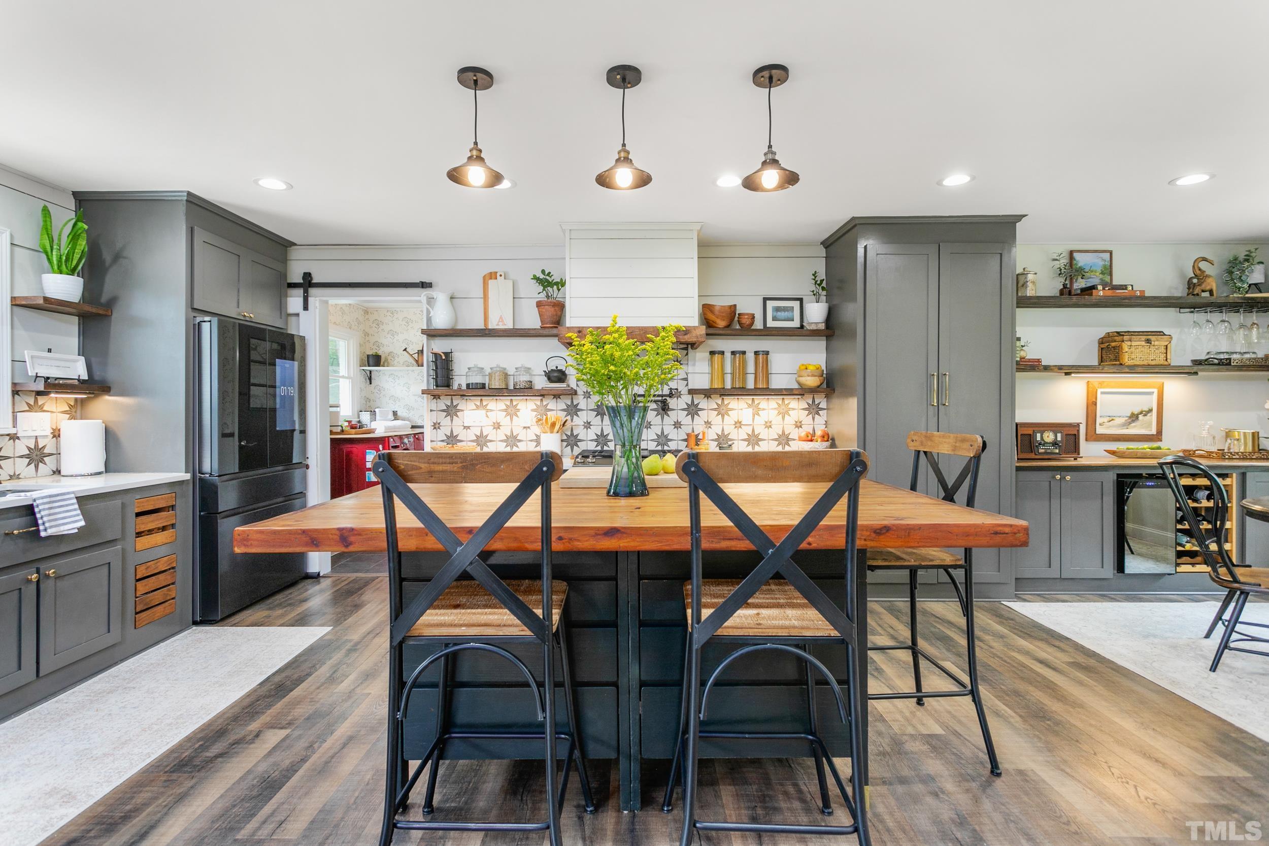 238 Alston Road Apex, NC 27523 - Photo 14 of 50 a view of a dining room with furniture