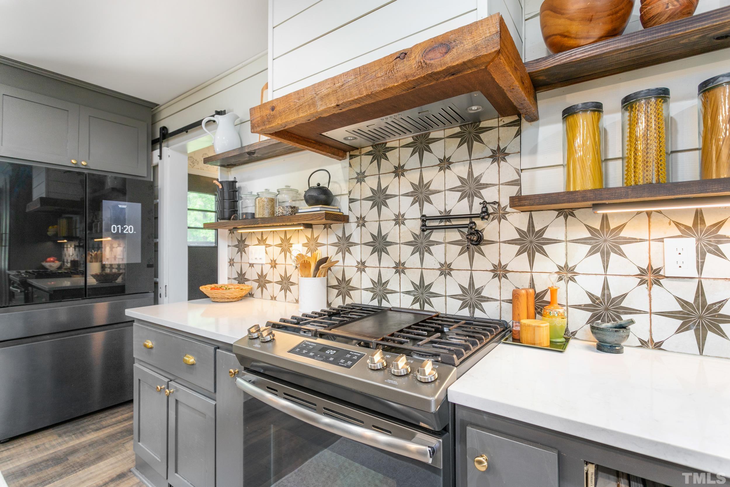 238 Alston Road Apex, NC 27523 - Photo 18 of 50 a stove top oven sitting inside of a kitchen
