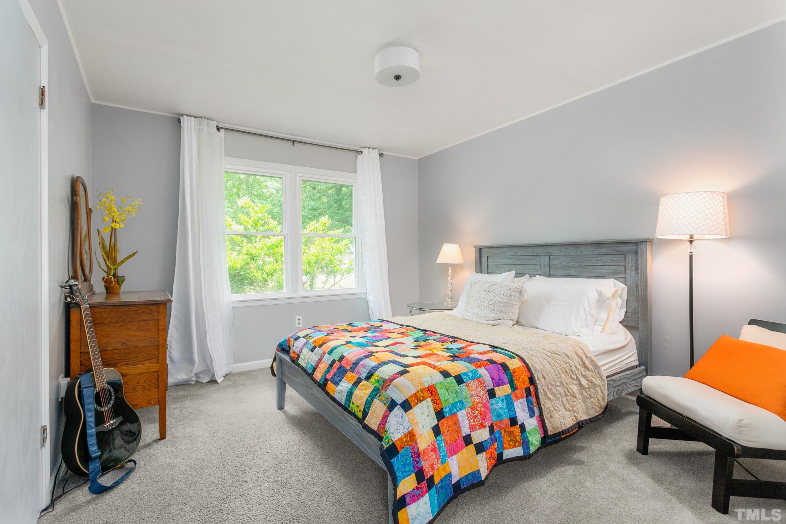 238 Alston Road Apex, NC 27523 - Photo 24 of 50 a bedroom with a bed and a window