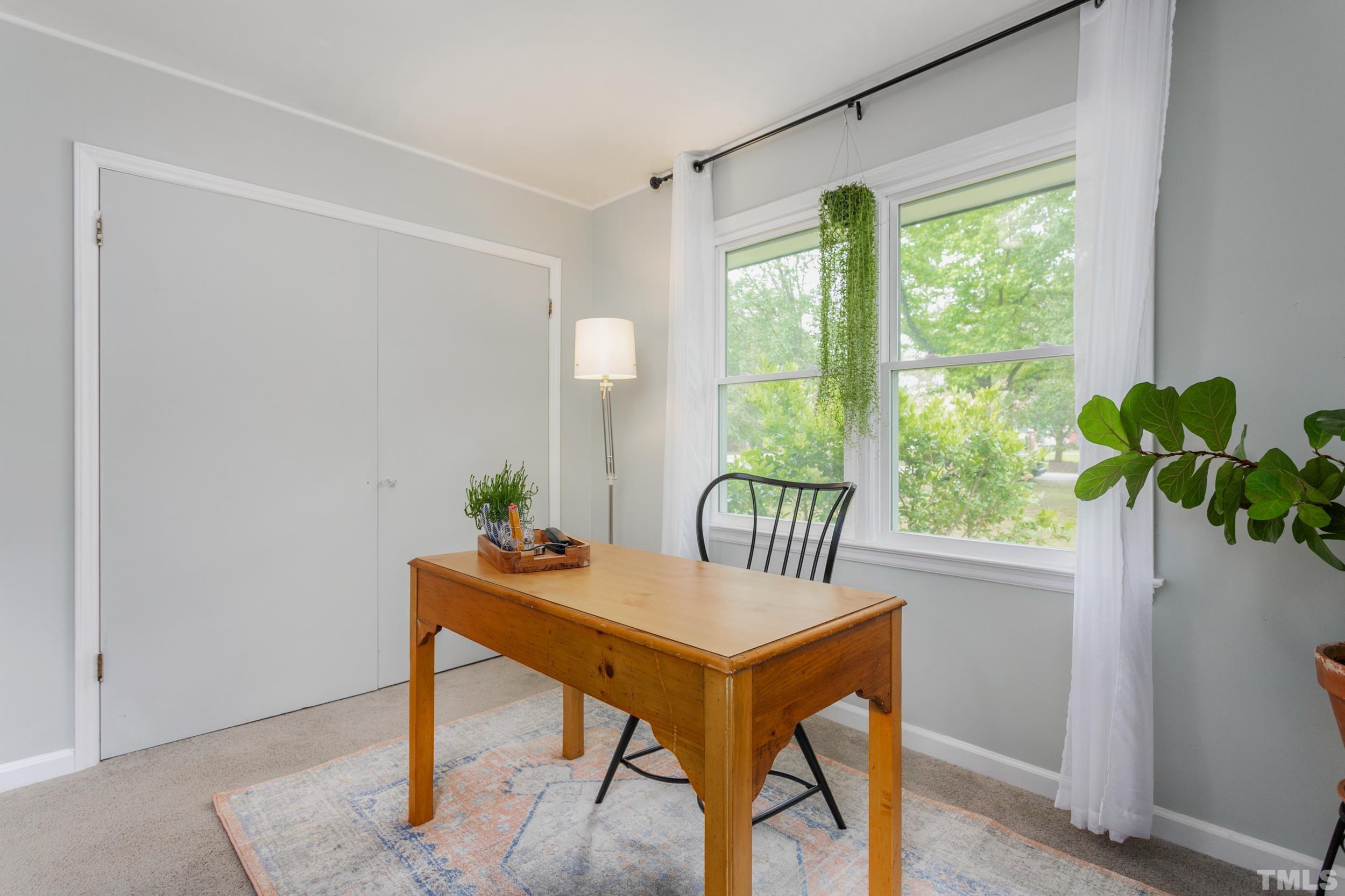 238 Alston Road Apex, NC 27523 - Photo 33 of 50 a workspace room with furniture and a potted plant