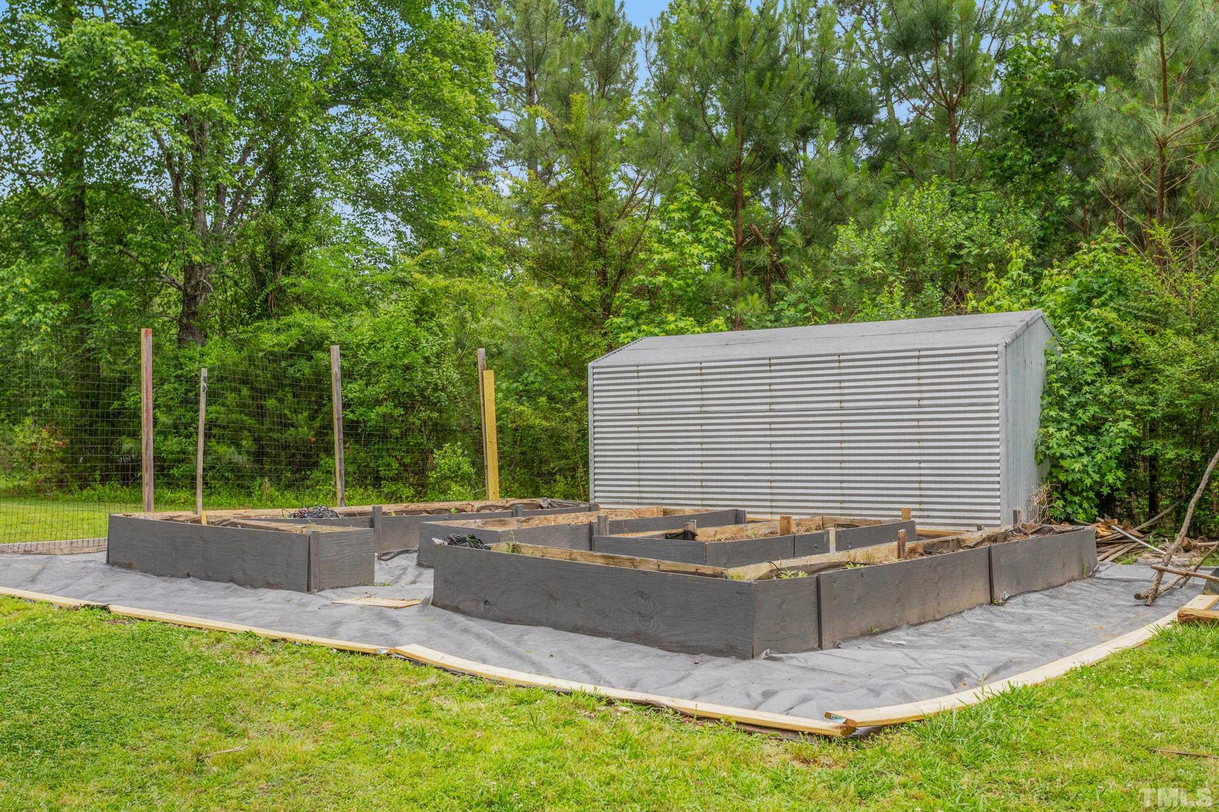 238 Alston Road Apex, NC 27523 - Photo 39 of 50 a backyard of a house with yard and outdoor seating