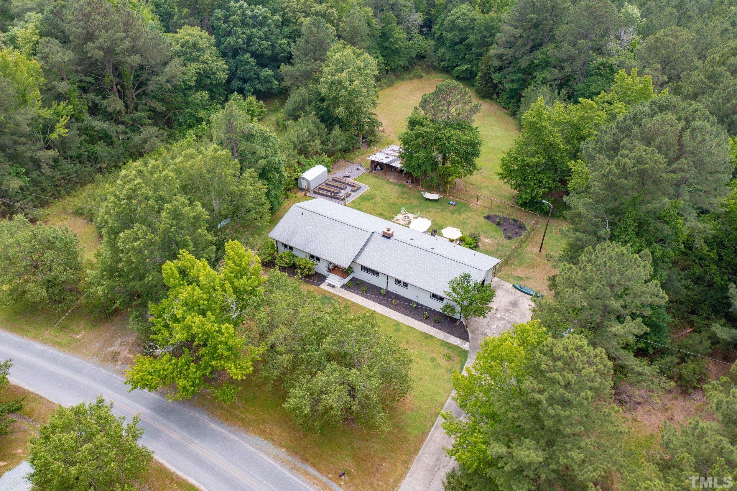 238 Alston Road Apex, NC 27523 - Photo 42 of 50 an aerial view of a house with a yard and lake view