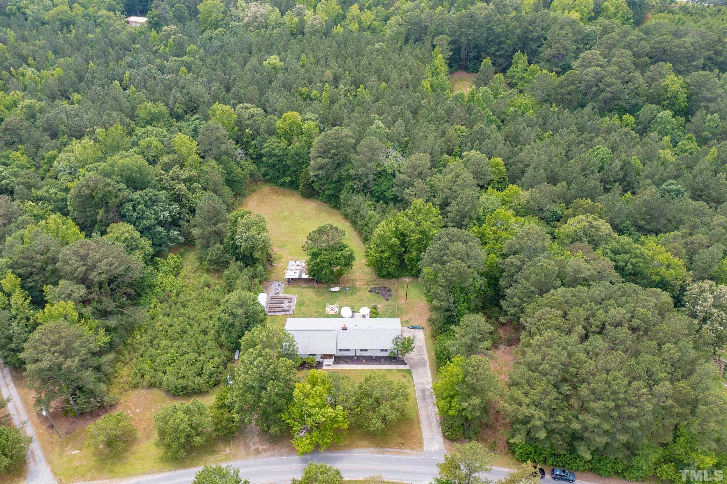 238 Alston Road Apex, NC 27523 - Photo 44 of 50 an aerial view of a house with a yard and lake view