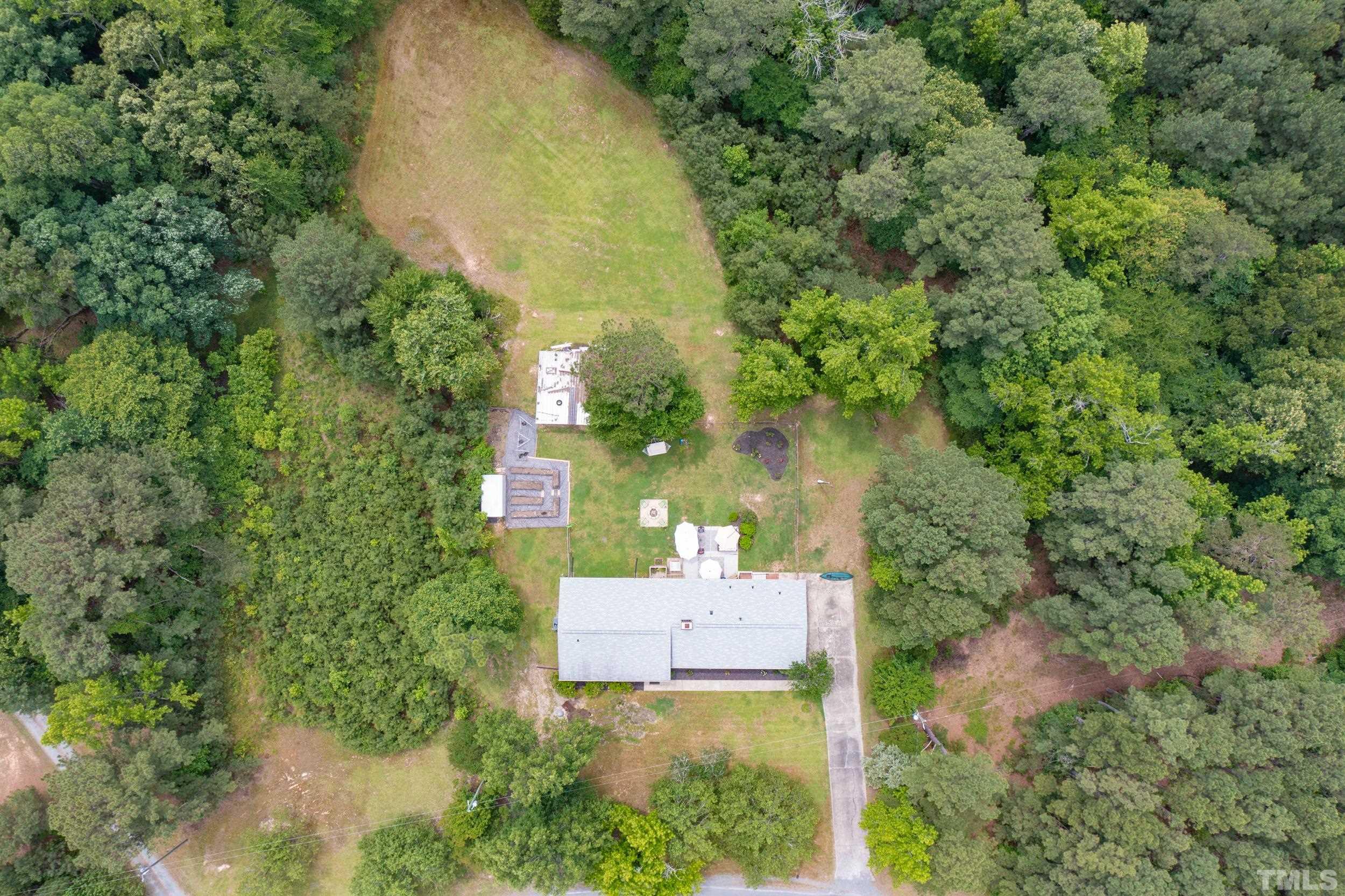 238 Alston Road Apex, NC 27523 - Photo 45 of 50 an aerial view of a house with yard and outdoor seating