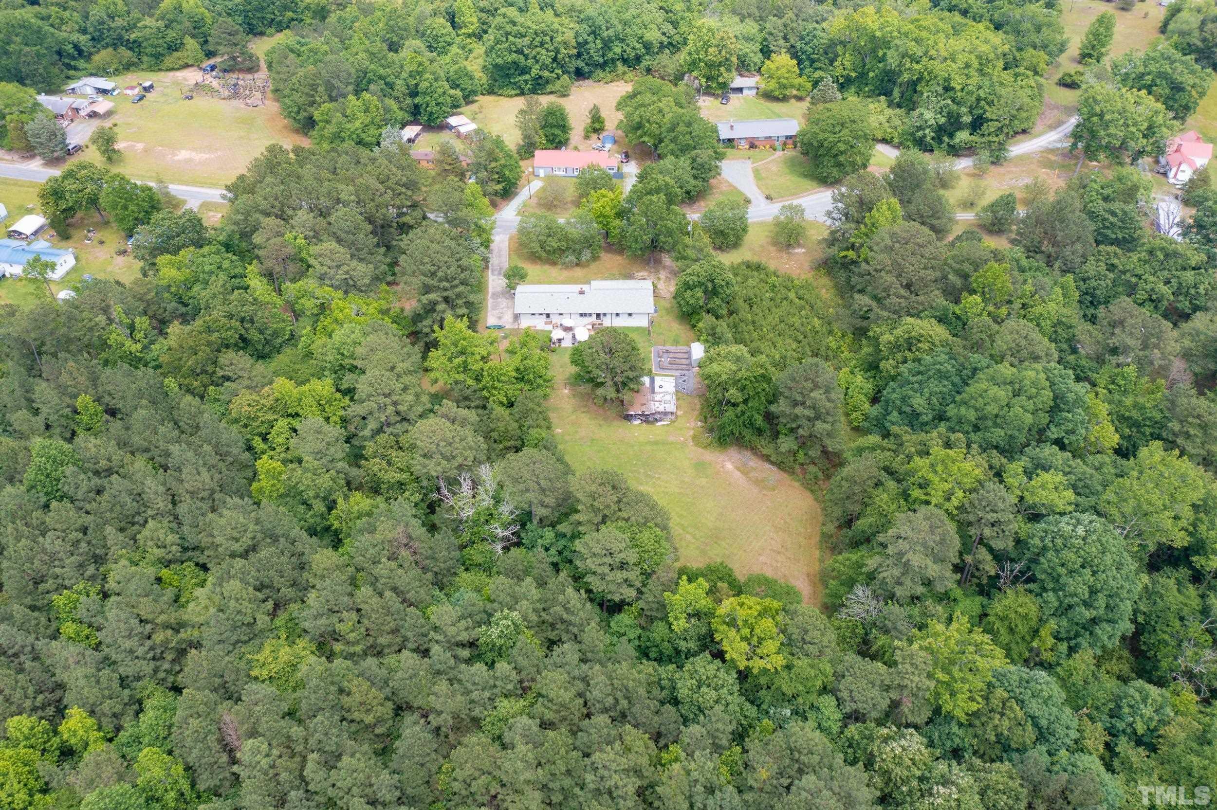 238 Alston Road Apex, NC 27523 - Photo 46 of 50 an aerial view of residential house with outdoor space and trees all around