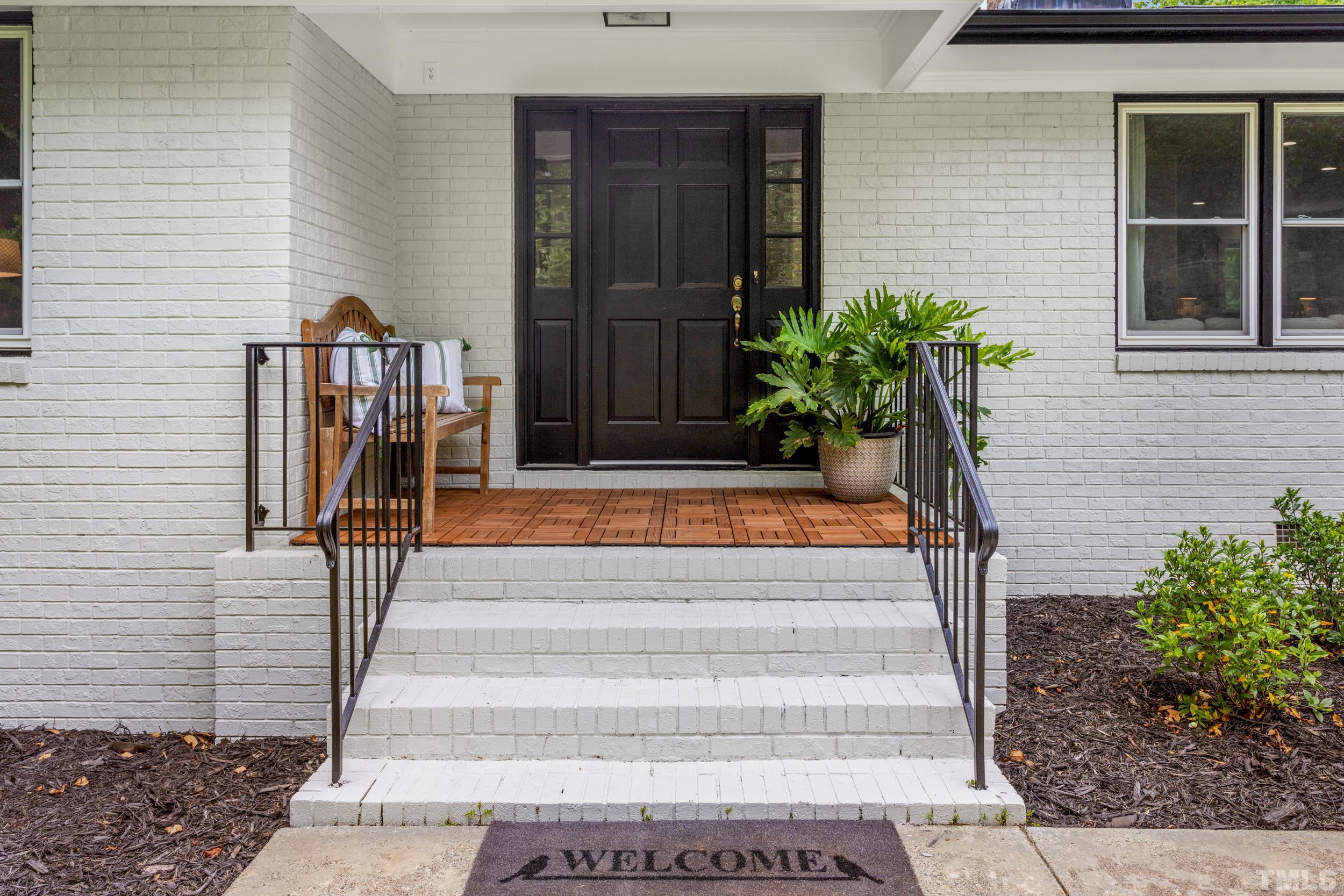 238 Alston Road Apex, NC 27523 - Photo 5 of 50 a front view of a house with potted plants