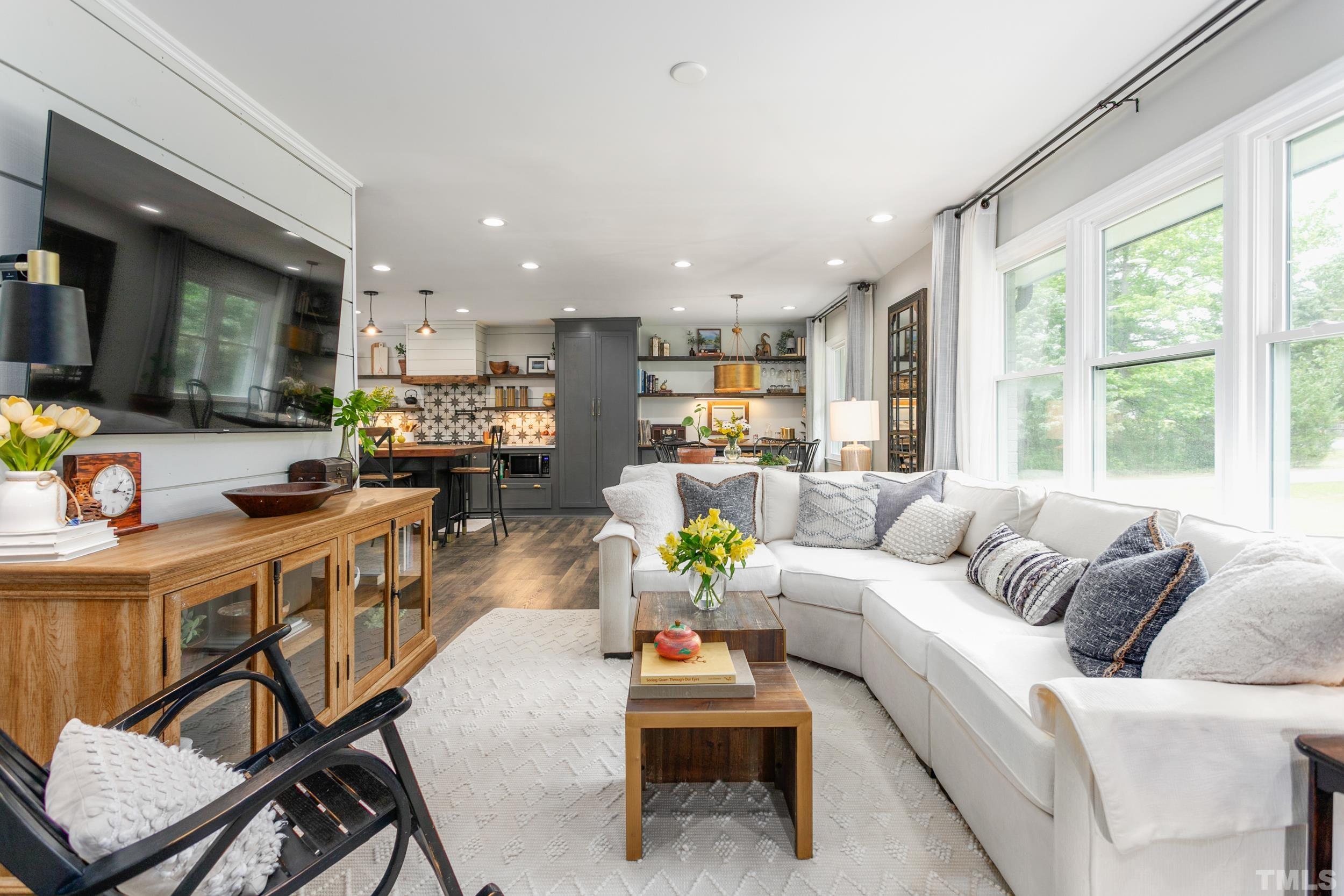238 Alston Road Apex, NC 27523 - Photo 8 of 50 a living room with furniture and a large window
