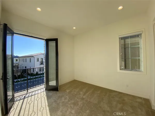 a view of a room with a floor to ceiling window