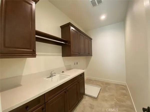 a utility room with cabinets