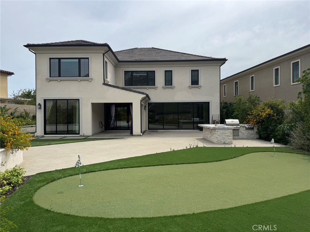 101 Interstellar Irvine, CA 92618 - Photo 16 of 24 a house view with a garden space