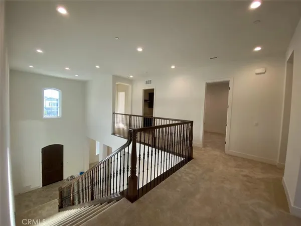 a view of a hallway with windows