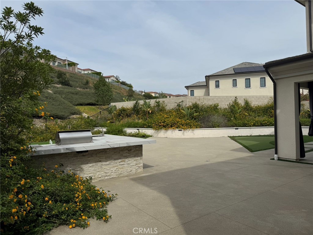101 Interstellar Irvine, CA 92618 - Photo 19 of 24 a view of a house with a yard