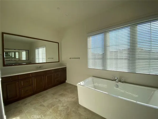 a bathroom with a bathtub and a sink
