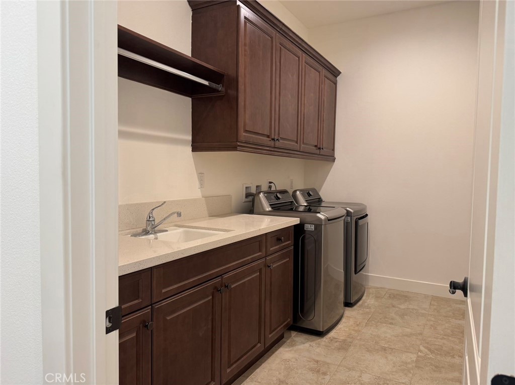 101 Interstellar Irvine, CA 92618 - Photo 22 of 24 a utility room with sink dryer and washer