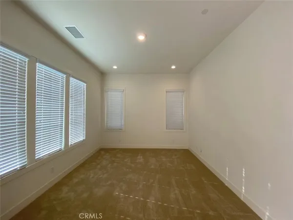 en empty room with windows