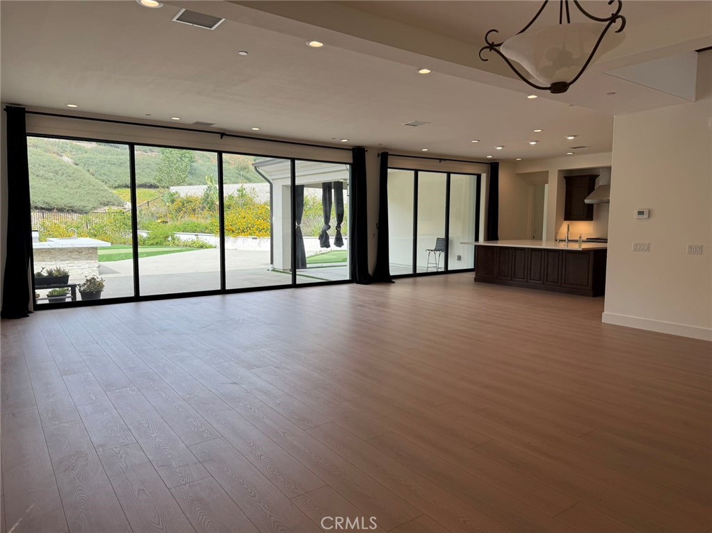101 Interstellar Irvine, CA 92618 - Photo 4 of 24 a view of an empty room with a sliding door and a window