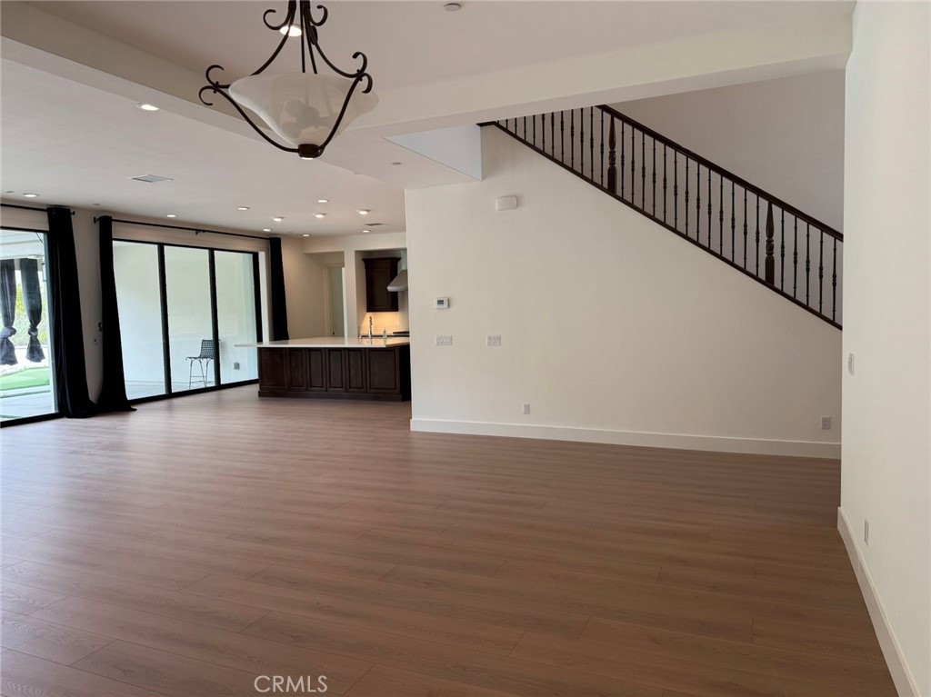 101 Interstellar Irvine, CA 92618 - Photo 5 of 24 a view of an entryway with wooden floor