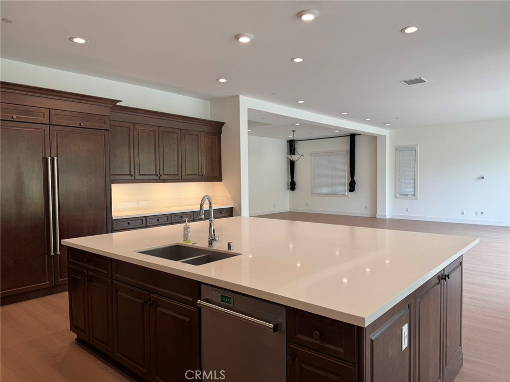 101 Interstellar Irvine, CA 92618 - Photo 7 of 24 a kitchen with kitchen island sink and refrigerator