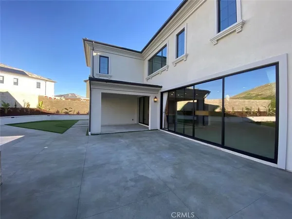a view of a house with a yard and garage