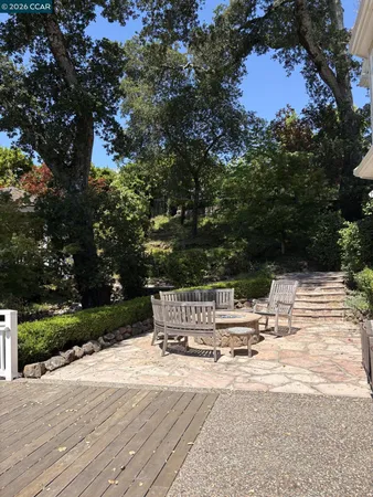 a view of house with outdoor space and seating