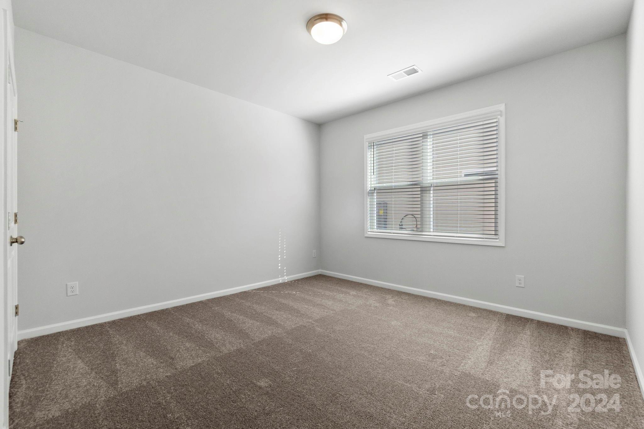 8204 Mccormick Street Terrell, NC 28682 - Photo 12 of 32 an empty room with a window