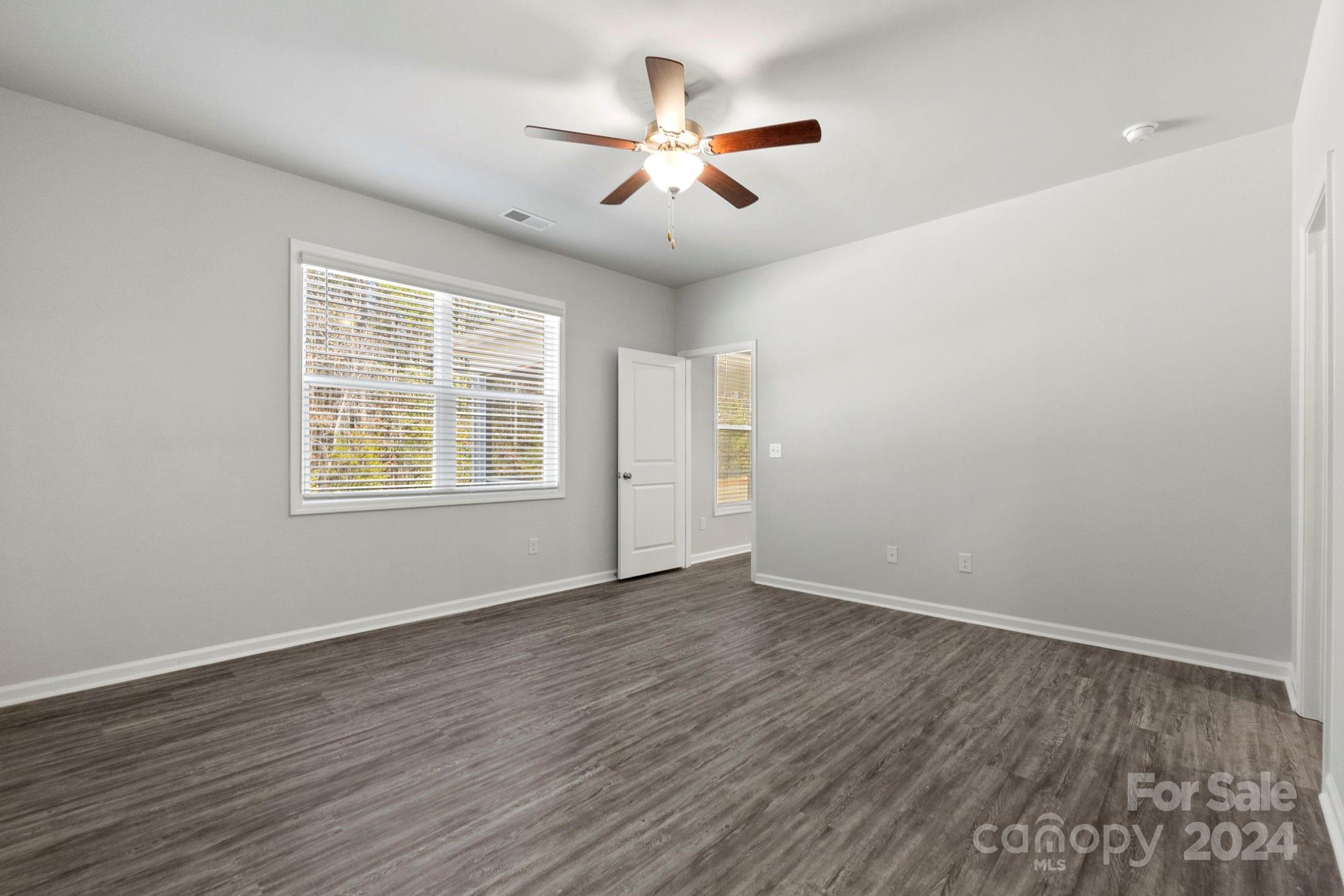 8204 Mccormick Street Terrell, NC 28682 - Photo 22 of 32 wooden floor in an empty room with a window