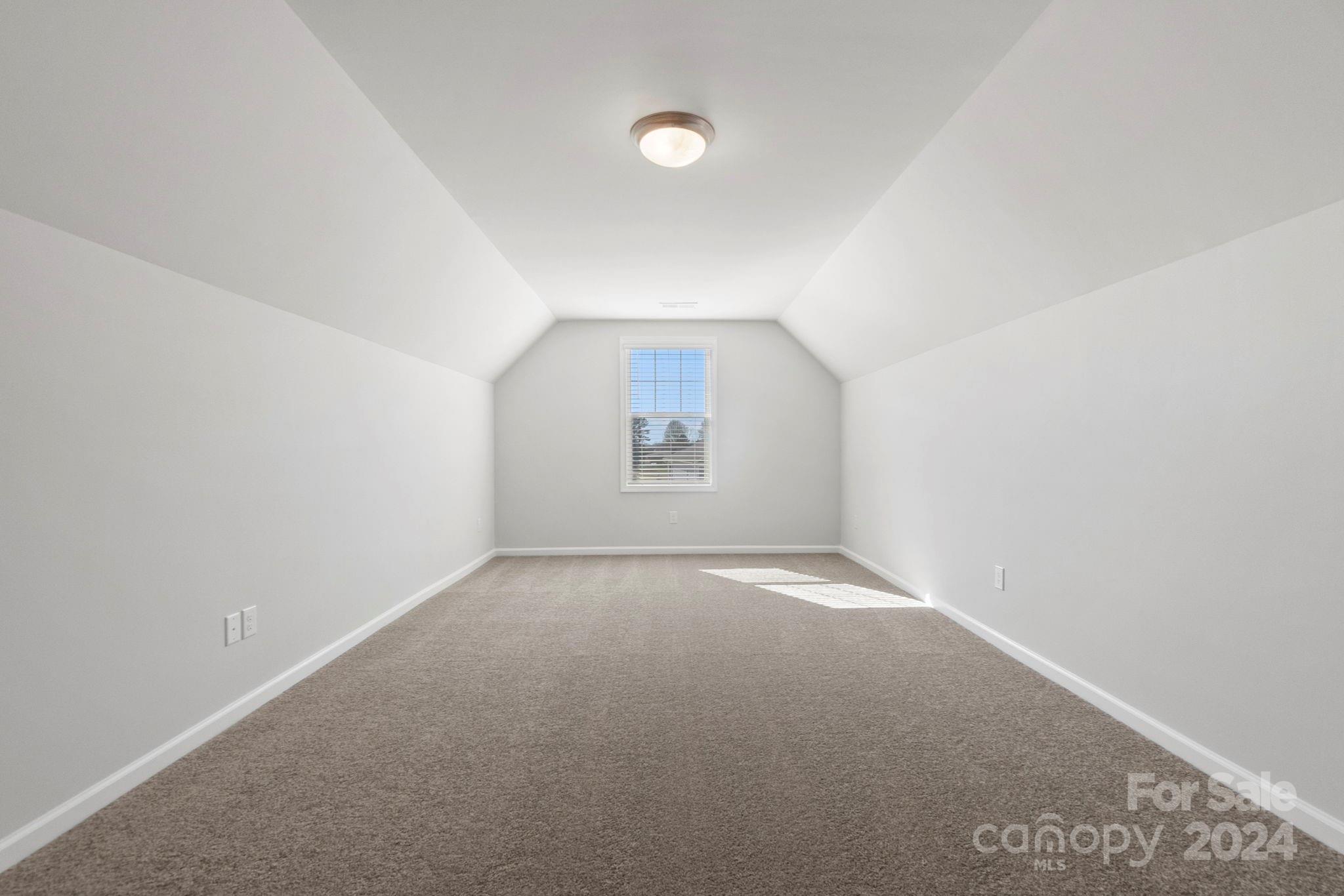 8204 Mccormick Street Terrell, NC 28682 - Photo 25 of 32 an empty room with a empty space and windows