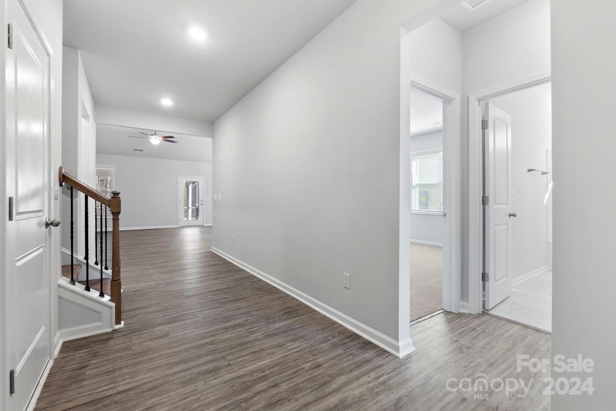 8204 Mccormick Street Terrell, NC 28682 - Photo 8 of 32 a view of a hallway with wooden floor