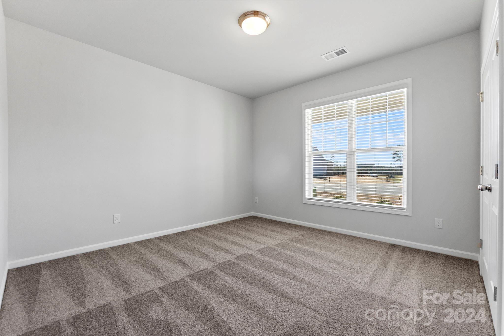 8204 Mccormick Street Terrell, NC 28682 - Photo 10 of 32 an empty room with a window