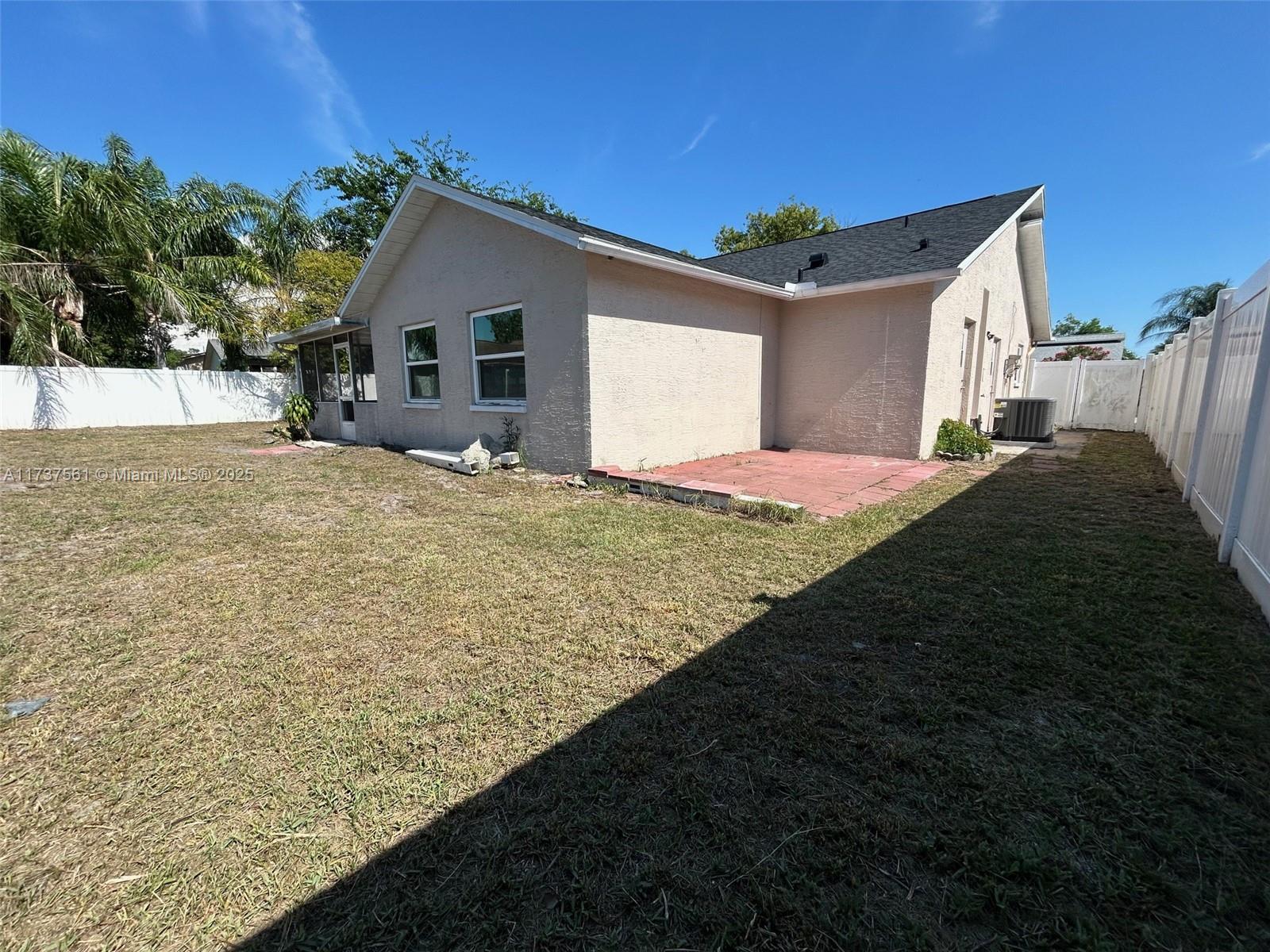 7403 Foxbloom Drive Port Richey, FL 34668 - Photo 37 of 45 a big white house with a yard