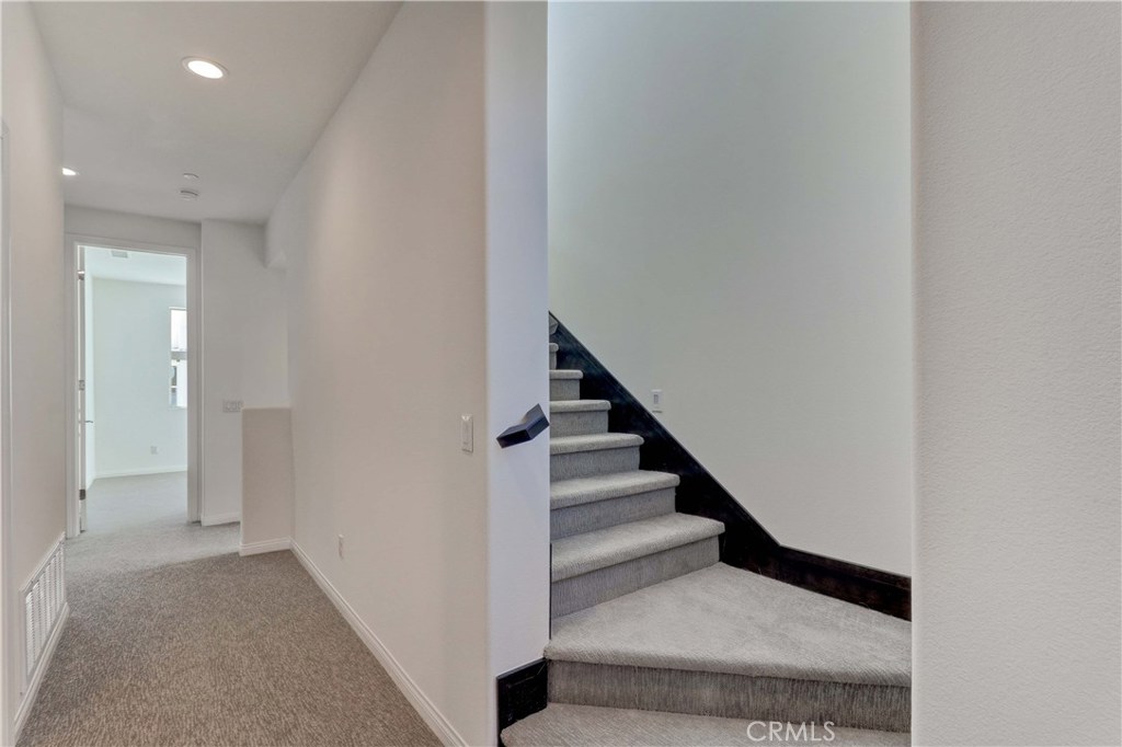 130 Spectacle Irvine, CA 92618 - Photo 12 of 38 a view of entryway and hall with wooden floor