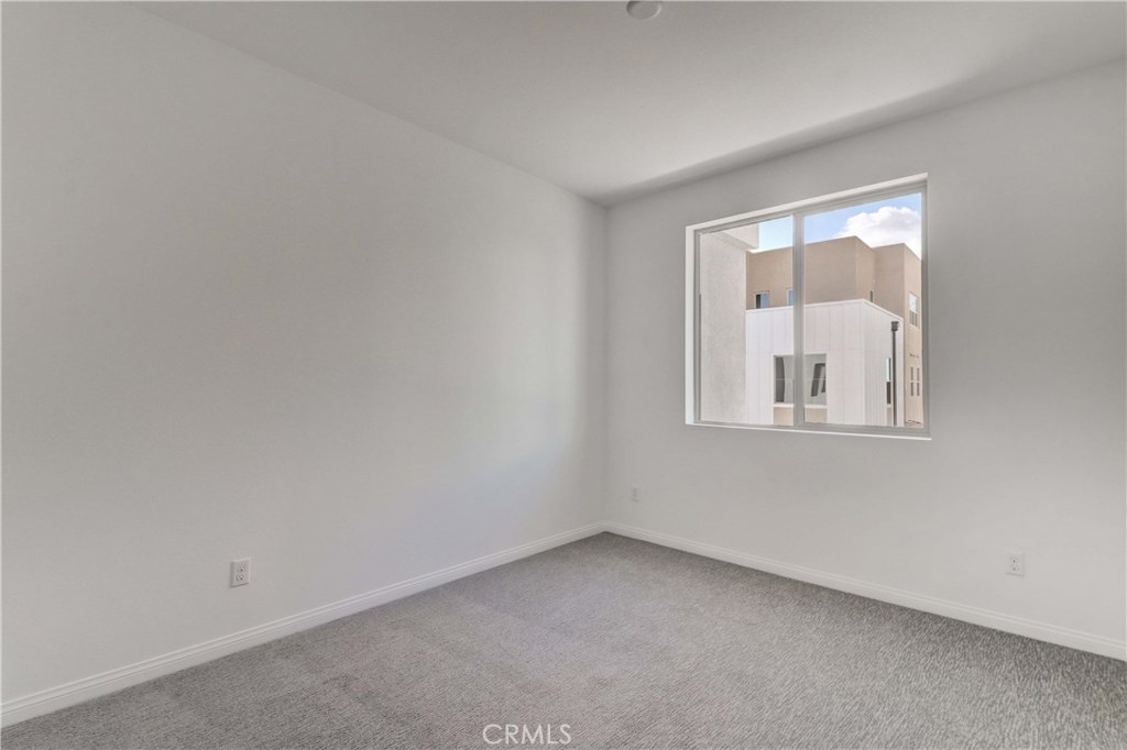 130 Spectacle Irvine, CA 92618 - Photo 19 of 38 an empty room with a window
