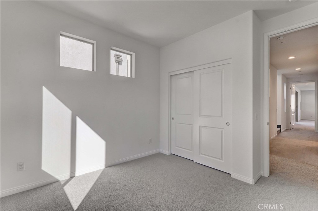 130 Spectacle Irvine, CA 92618 - Photo 20 of 38 a view of an empty room with closet and a window
