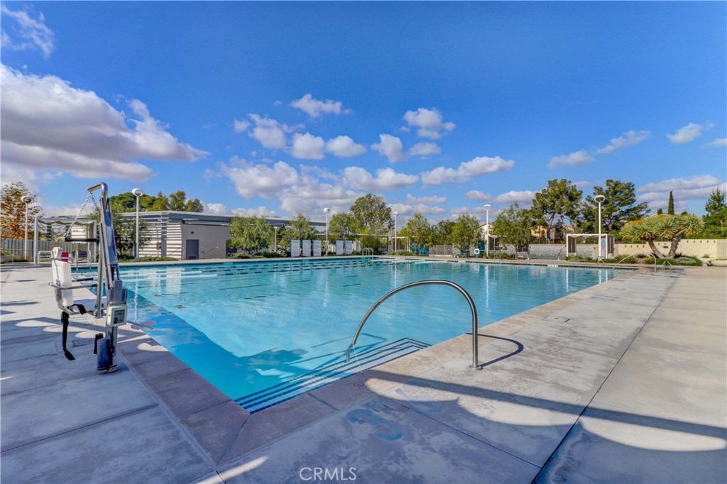 130 Spectacle Irvine, CA 92618 - Photo 30 of 38 a view of swimming pool with a yard