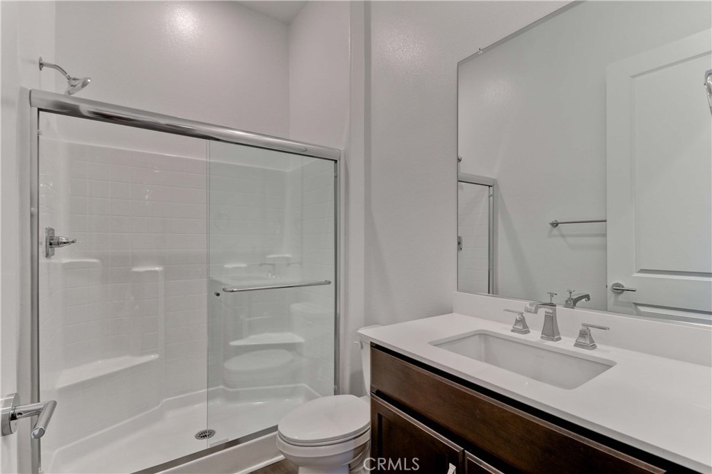 130 Spectacle Irvine, CA 92618 - Photo 9 of 38 a bathroom with a granite countertop sink toilet and shower