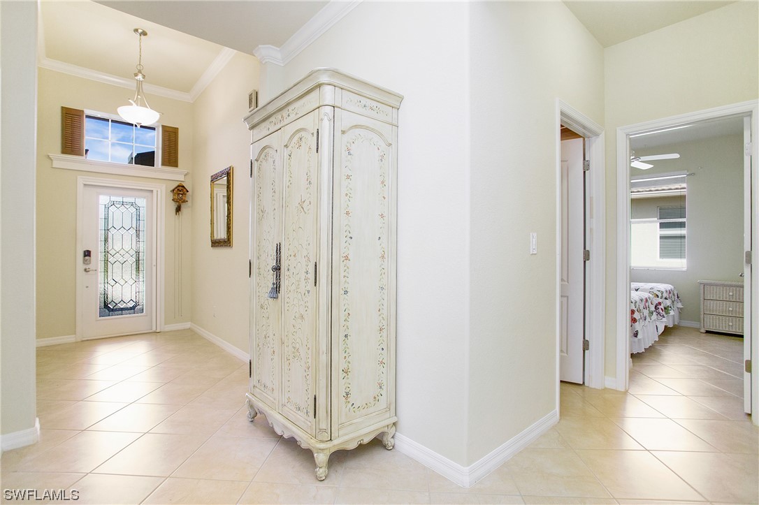 7948 Princeton Drive Naples, FL 34104 - Photo 17 of 35 a spacious bathroom with a glass shower door and a sink