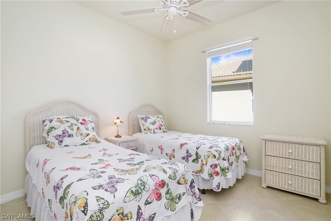 7948 Princeton Drive Naples, FL 34104 - Photo 19 of 35 a bedroom with a bed and a window