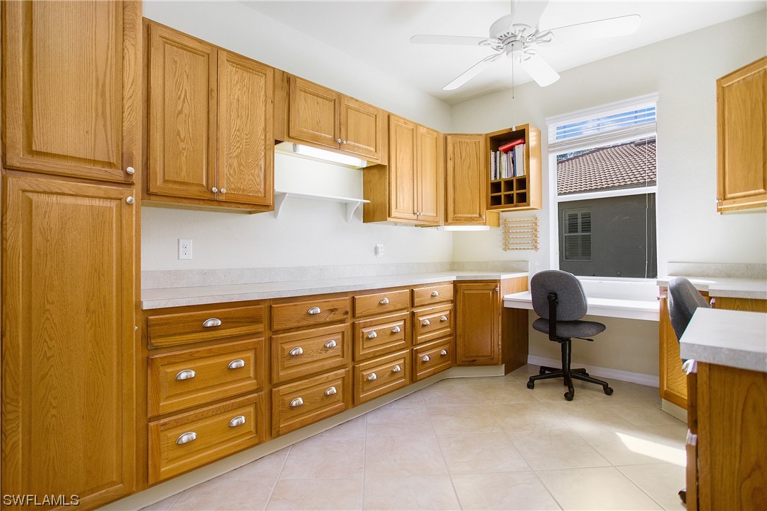 7948 Princeton Drive Naples, FL 34104 - Photo 24 of 35 a bedroom with a chair and a dresser