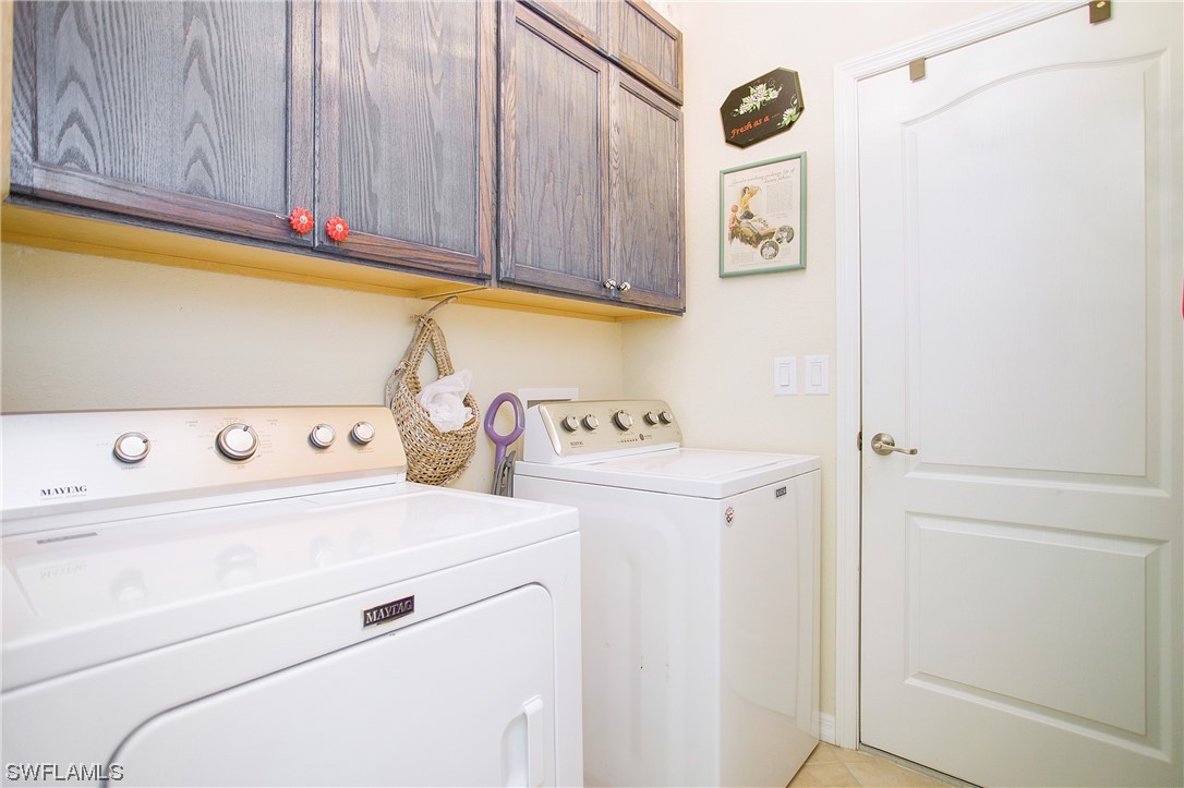 7948 Princeton Drive Naples, FL 34104 - Photo 26 of 35 a utility room with dryer and washer