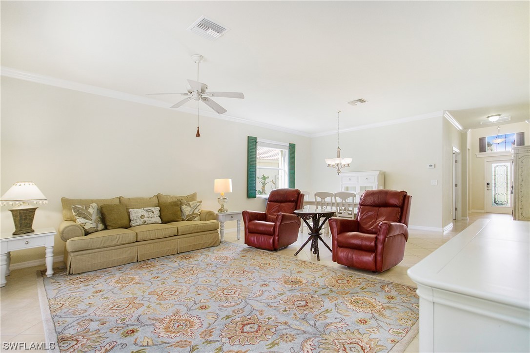 7948 Princeton Drive Naples, FL 34104 - Photo 9 of 35 a living room with furniture