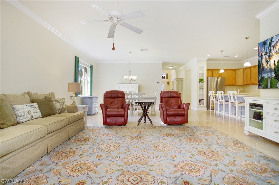 7948 Princeton Drive Naples, FL 34104 - Photo 10 of 35 a living room with furniture a couch and kitchen view