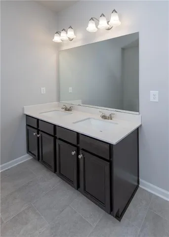 a room with a sink vanity and mirror