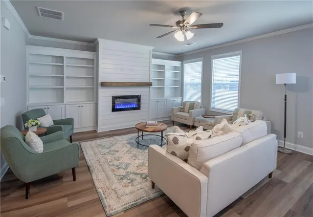 a living room with furniture and a fireplace