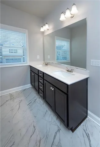 a bathroom with a sink vanity and a mirror