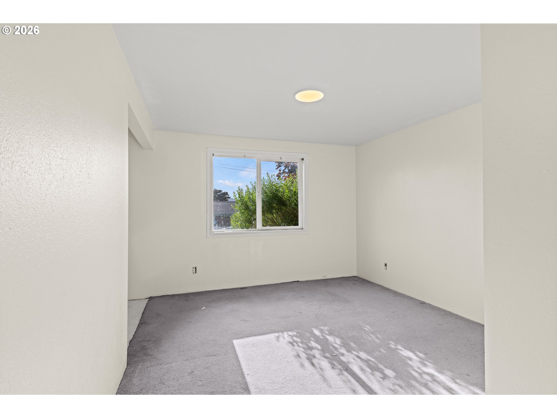 1816 Sunset Court Myrtle Point, OR 97458 - Photo 28 of 42 an empty room with wooden floor and windows