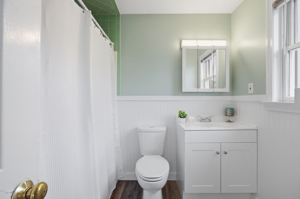 192 Swifts Beach Road Wareham, MA 02571 - Photo 33 of 38 a bathroom with a toilet a sink and mirror