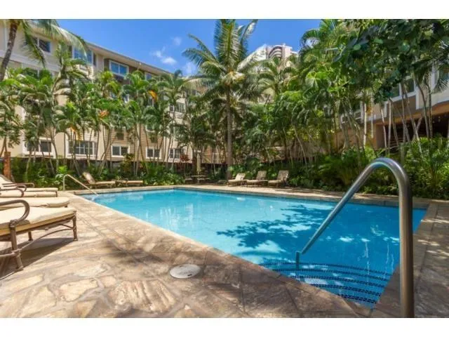 a view of a swimming pool with a patio