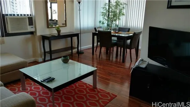 a view of a dining room with furniture and window